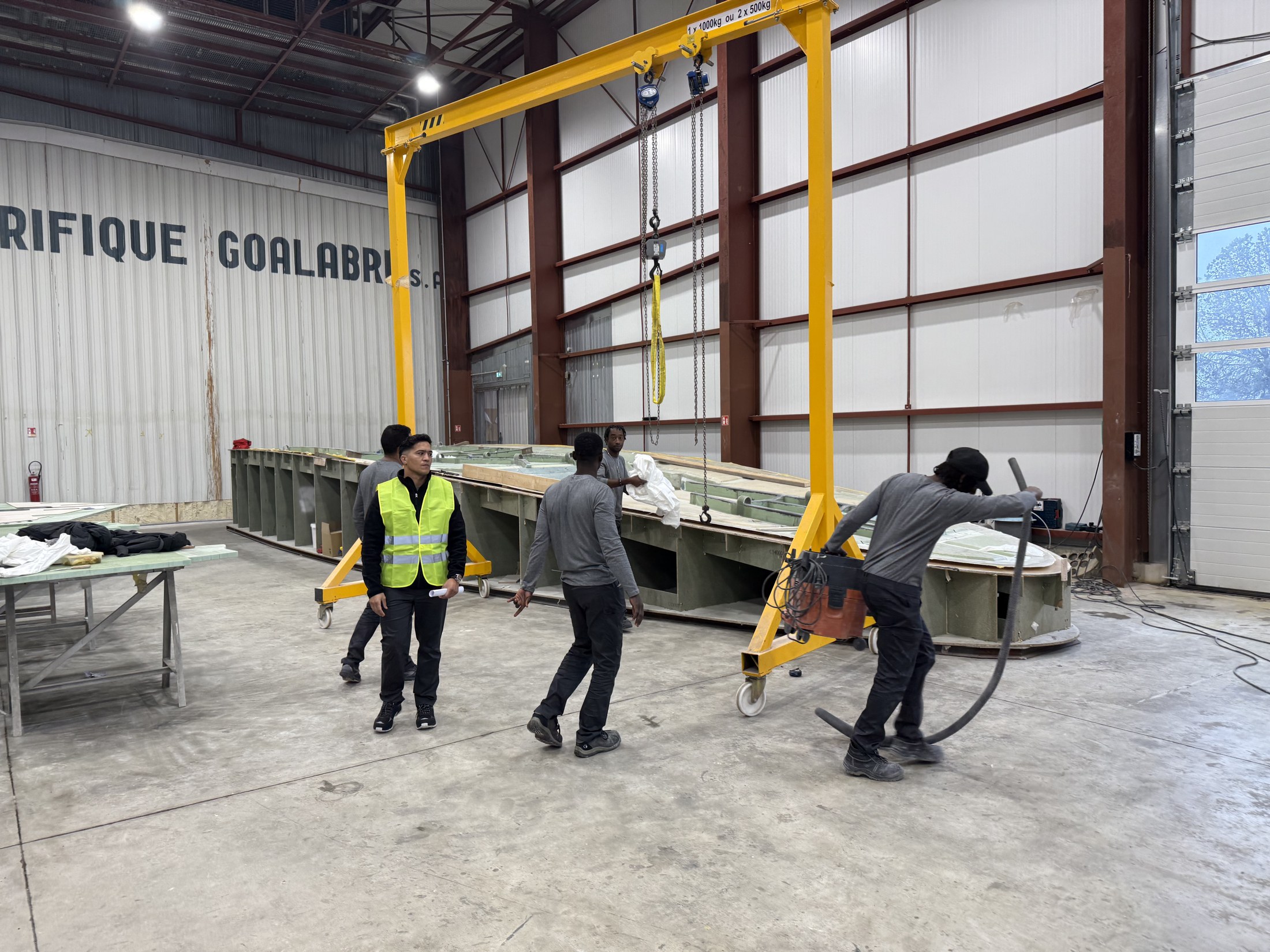 Multicultural crew at work — composite workshop